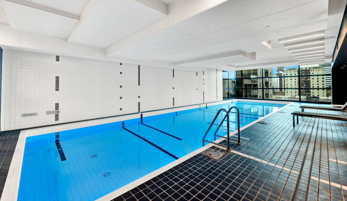 Aurora: the building’s shared indoor pool — heated, open 6:00 AM to 10:00 PM with your building fob