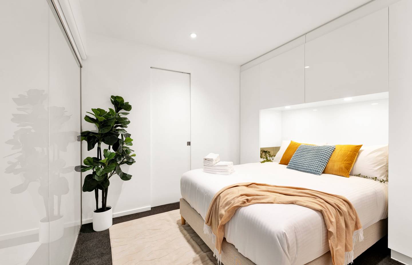 Aurora: second bedroom, an internal room — a second queen bed, with a roller blind that keeps it very dark