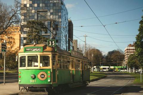 A City Circle tram, route 35, a heritage tram in green and gold.
