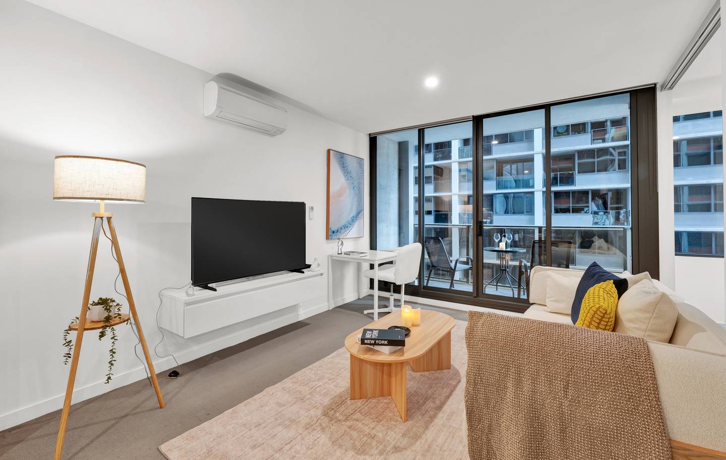 Madison: living area — stretch out on the sofa with the smart TV, or work at the desk by the balcony doors