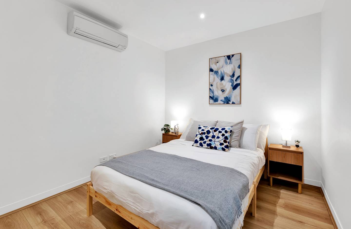 Spencer: second bedroom, an internal room — a double bed made up in hotel-grade linen, with its own air conditioning