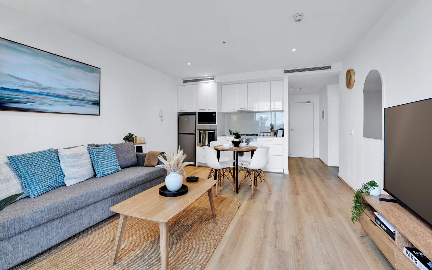Spencer: living, dining and kitchen — one bright open-plan room, from the sofa and the 65-inch smart TV to the table for four