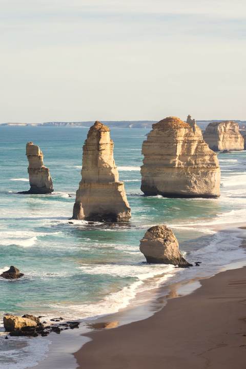 The Twelve Apostles, limestone stacks rising from a turquoise sea along the Great Ocean Road.